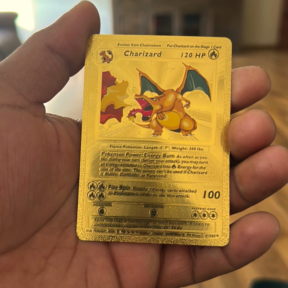 Selling my gold foil charizard card first edition in excellent condition